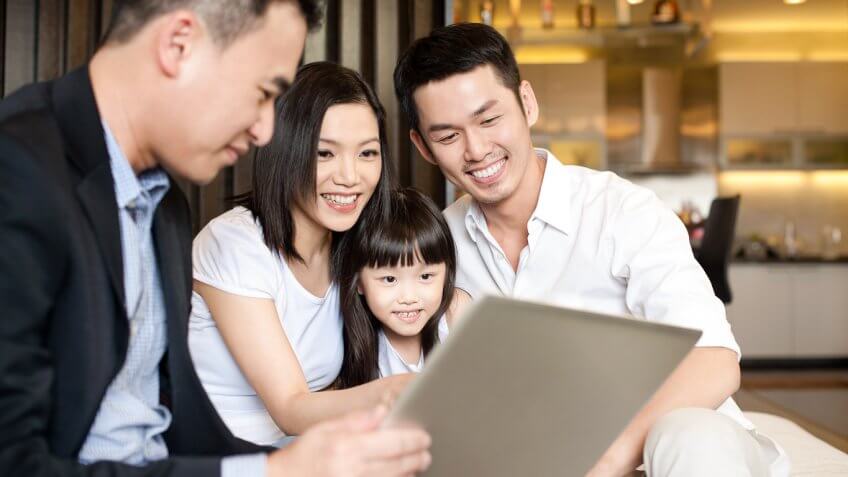 Young family reviewing paperwork Young family reviewing paperwork