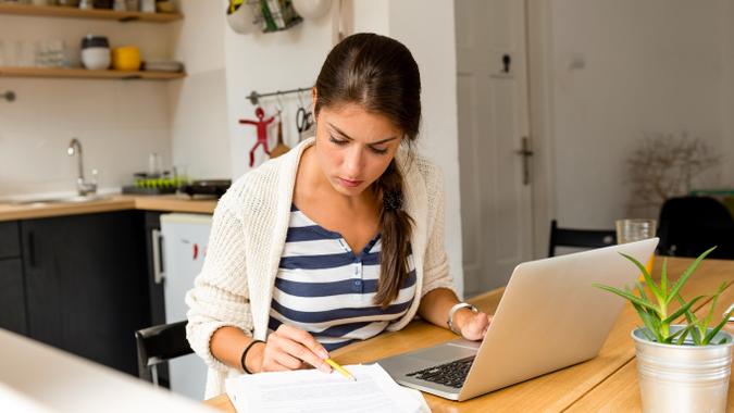 woman doing work on her laptop