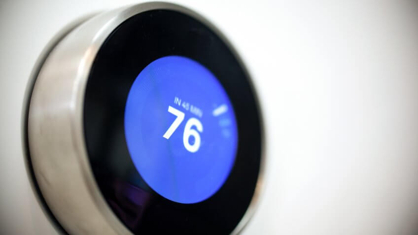 studio shot of modern thermostat.