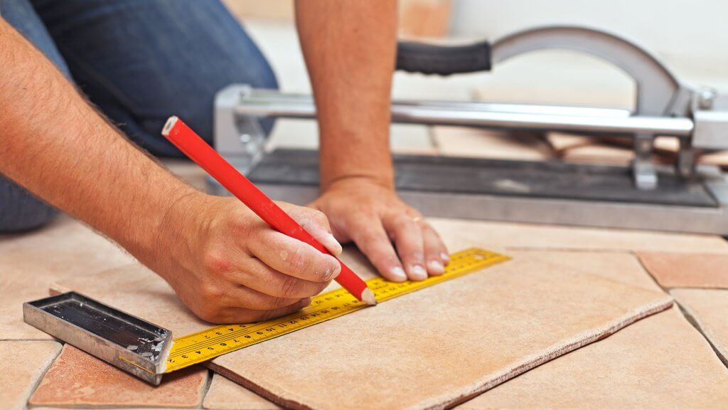 You can upgrade it as you like. contractor making measurements on floor tile