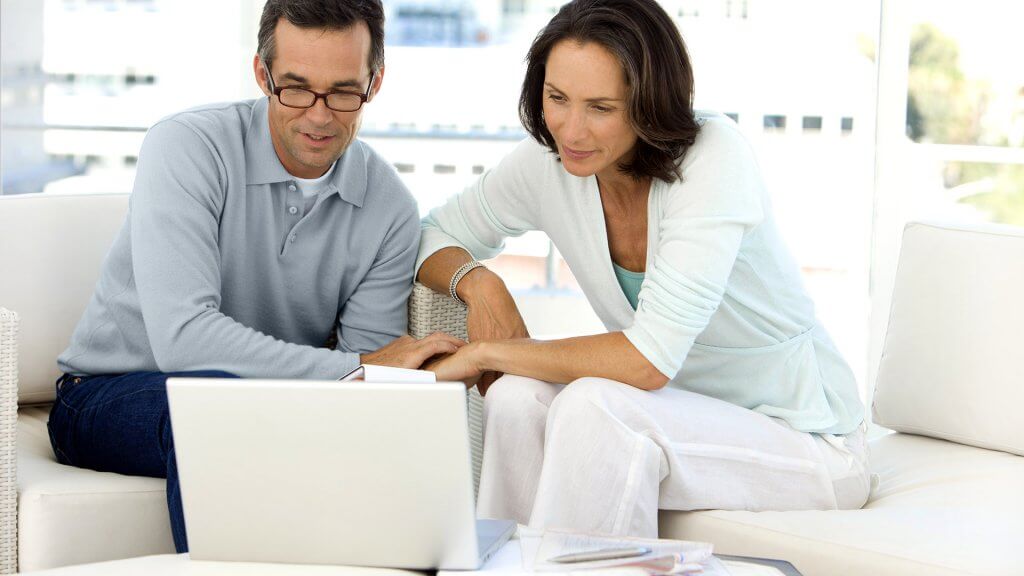 Refinance your mortgage. couple looking at laptop