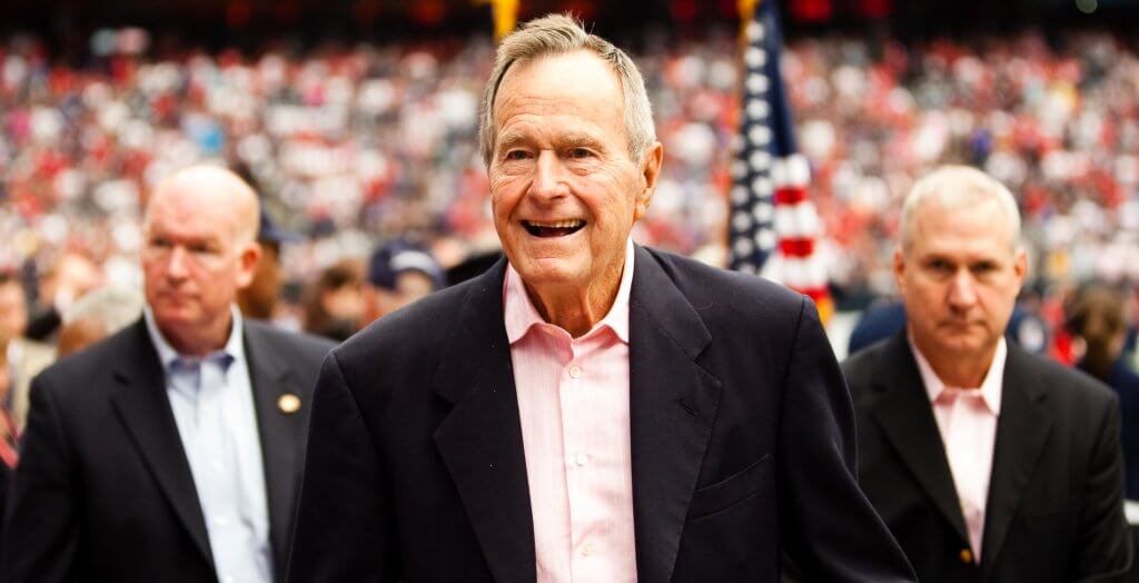 Bush senior underpaid his first year in office, but issued a check to the IRS to make up the difference. george h.w. bush at a football game