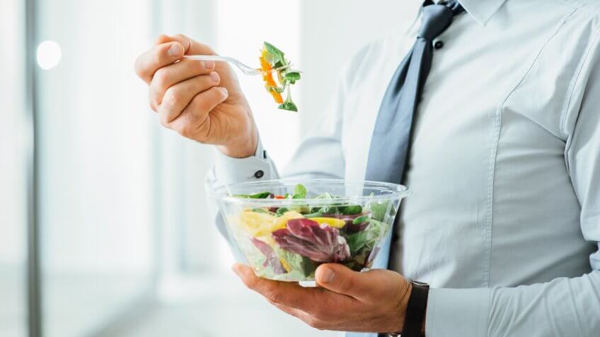 businessman eating a salad
