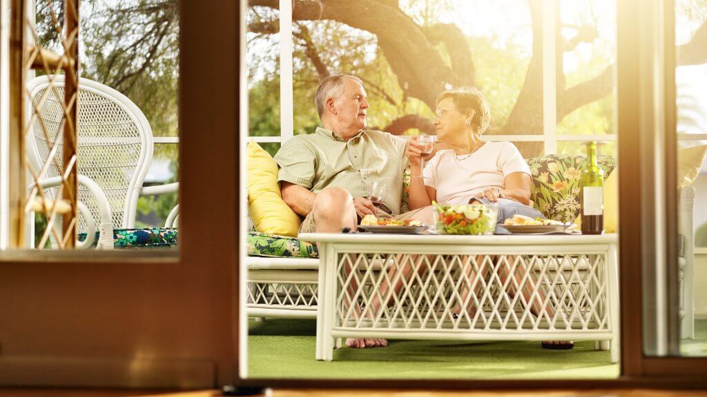 Prioritize your retirement over all other expenses. retired couple relaxing at home