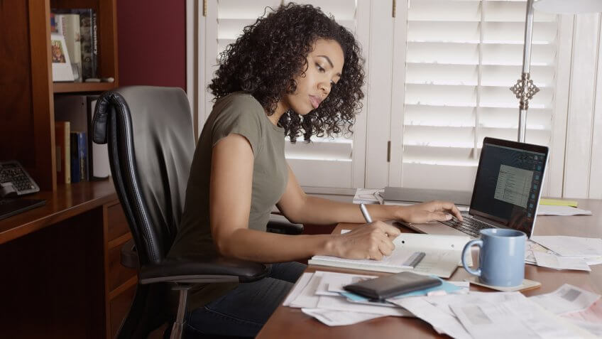 Take baby steps when trying to achieve your goal. woman concentrating on work in her office