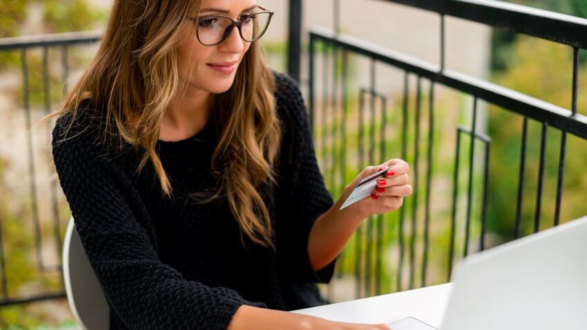 Young woman making online payment.