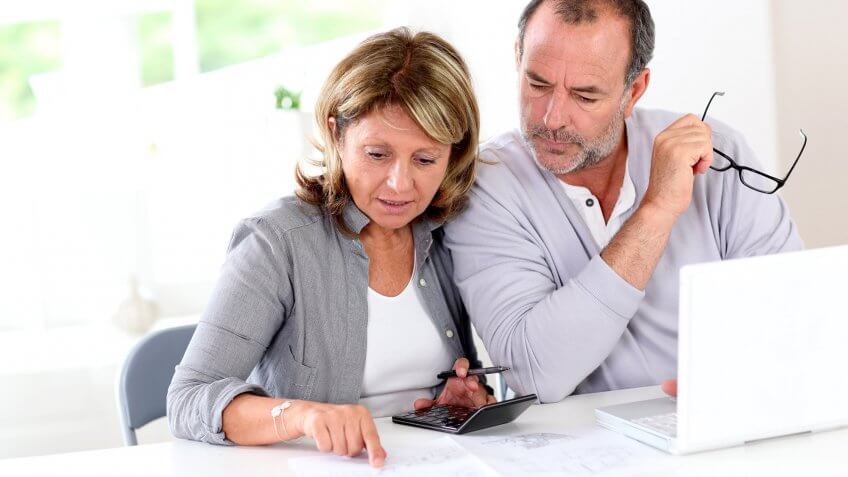 Stay on top of your Social Security benefits. couple making calculations