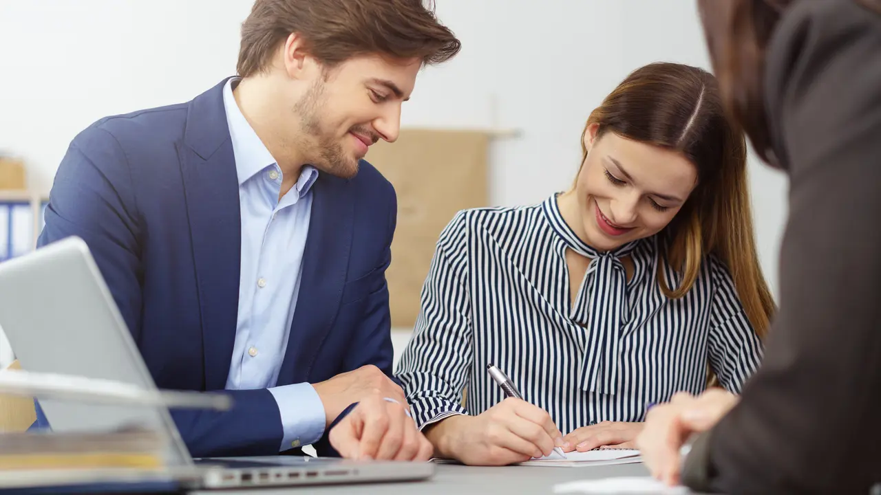 Woman co-signs a loan.
