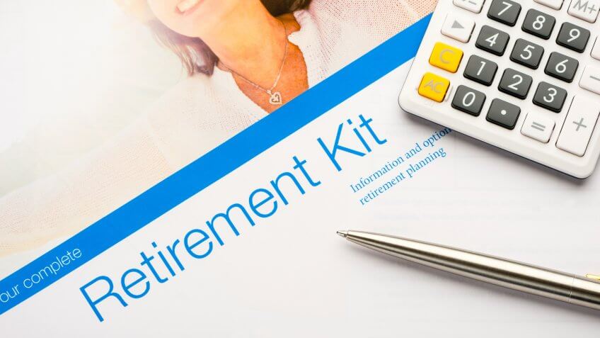 Retirement planning kit on a desk with paperwork.