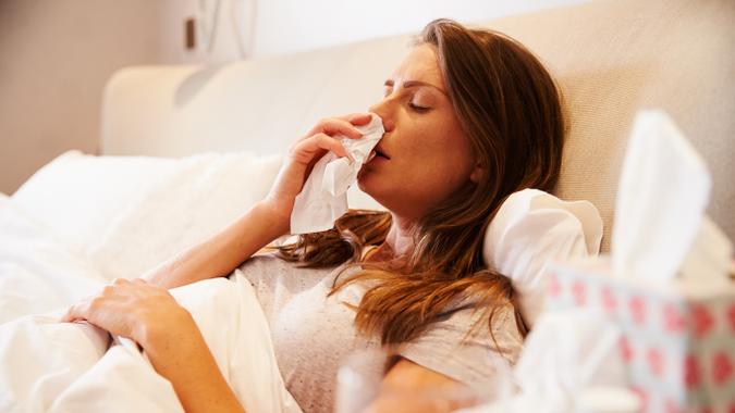 Woman sick in bed