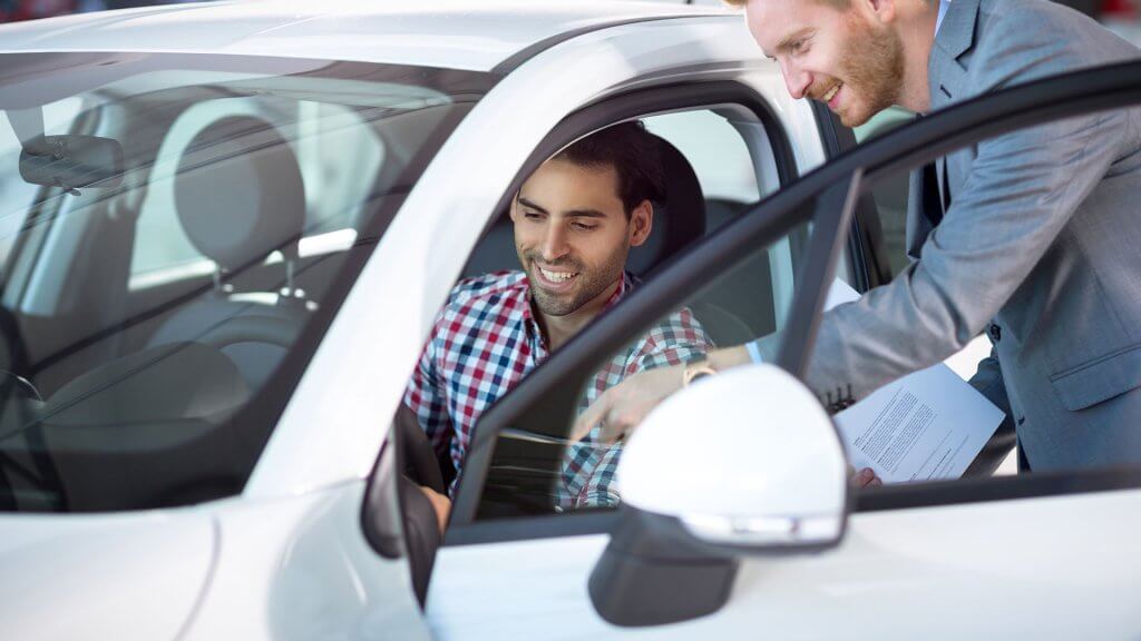 You Need a New Car car salesman showing car to man