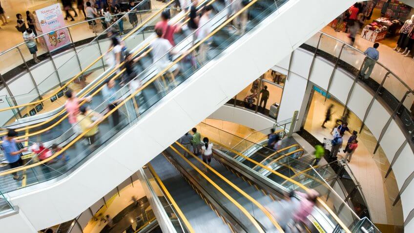shot of escalators inside a busy mall
