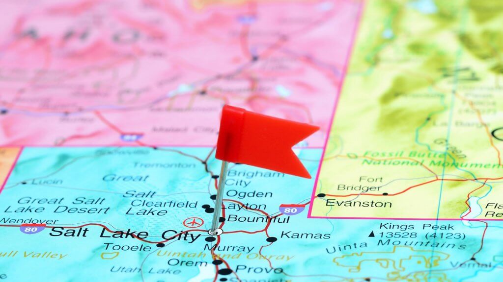 Choose the right ski resort. tiny flag pinned to map on salt lake city