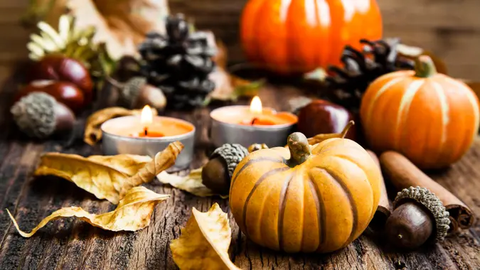 Pumpkins Decoration with Candles, Leaves, Acorns.