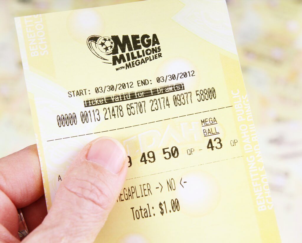 Betting on Lottery Tickets person holding lottery ticket