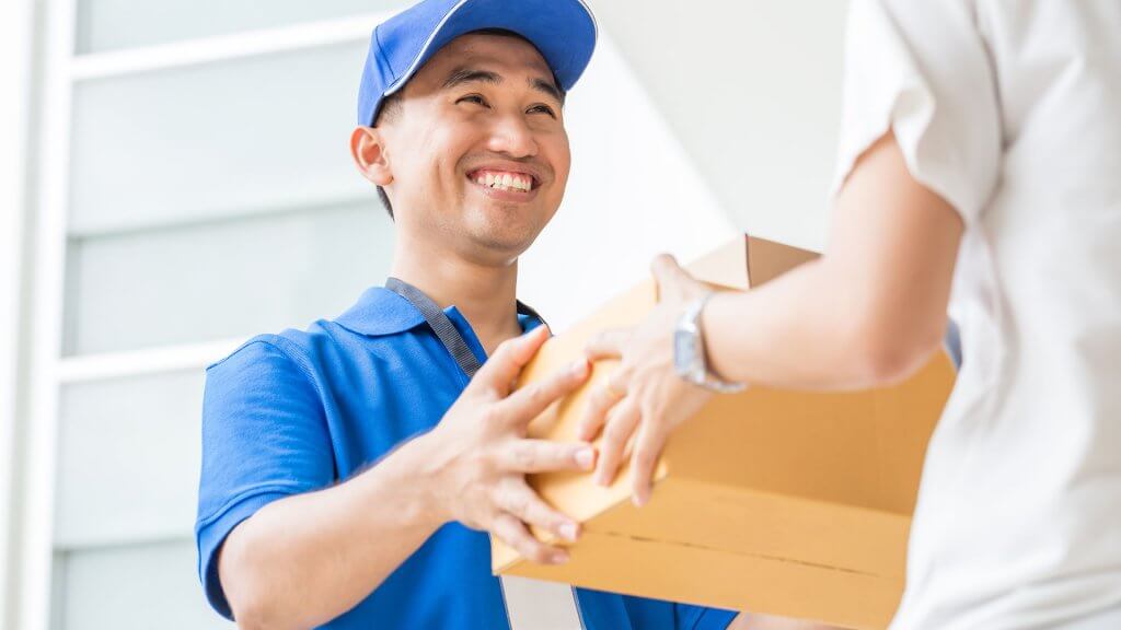 Shipping Fees deliever man handing woman package