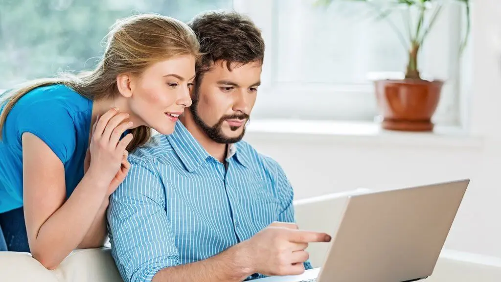 couple looking at laptop