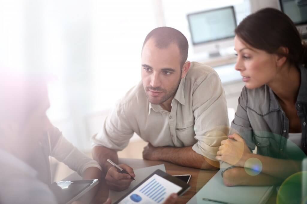 They create robust financial plans man and woman talking to financial planner