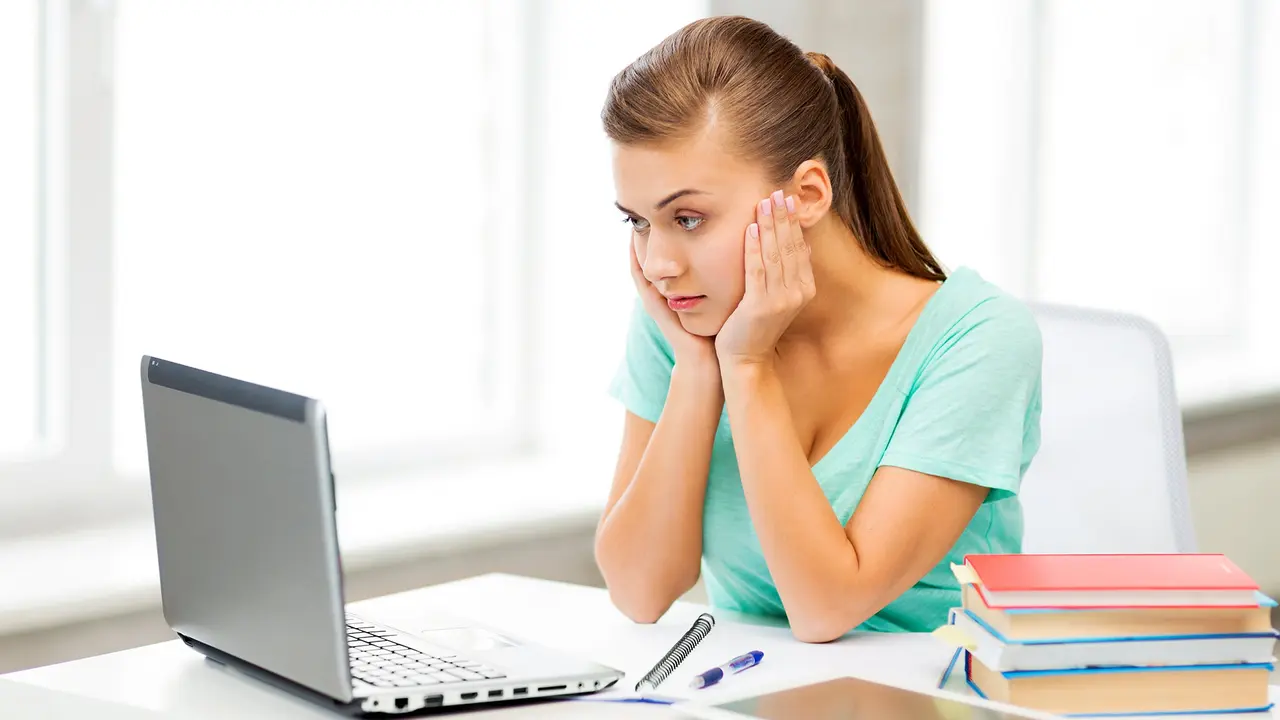 woman distressed looking at computer
