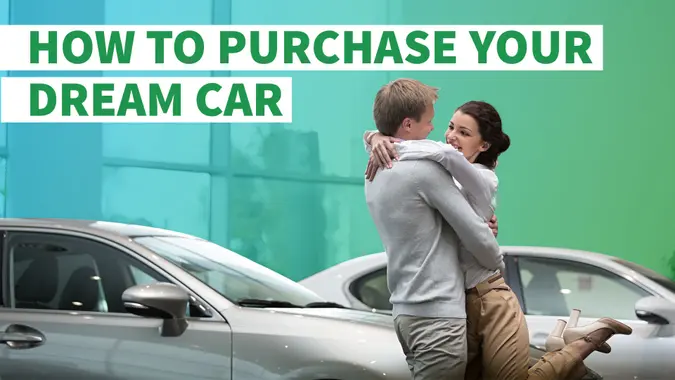 man and woman celebrate new car purchase