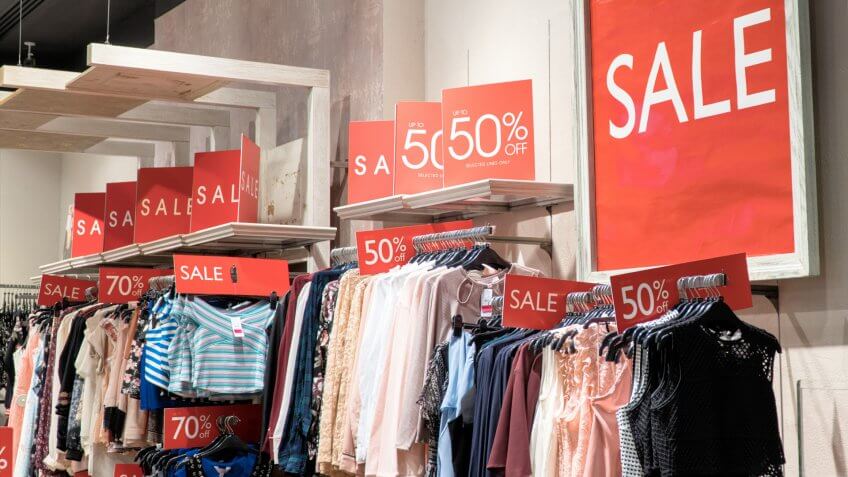 red sale signs in a clothing store