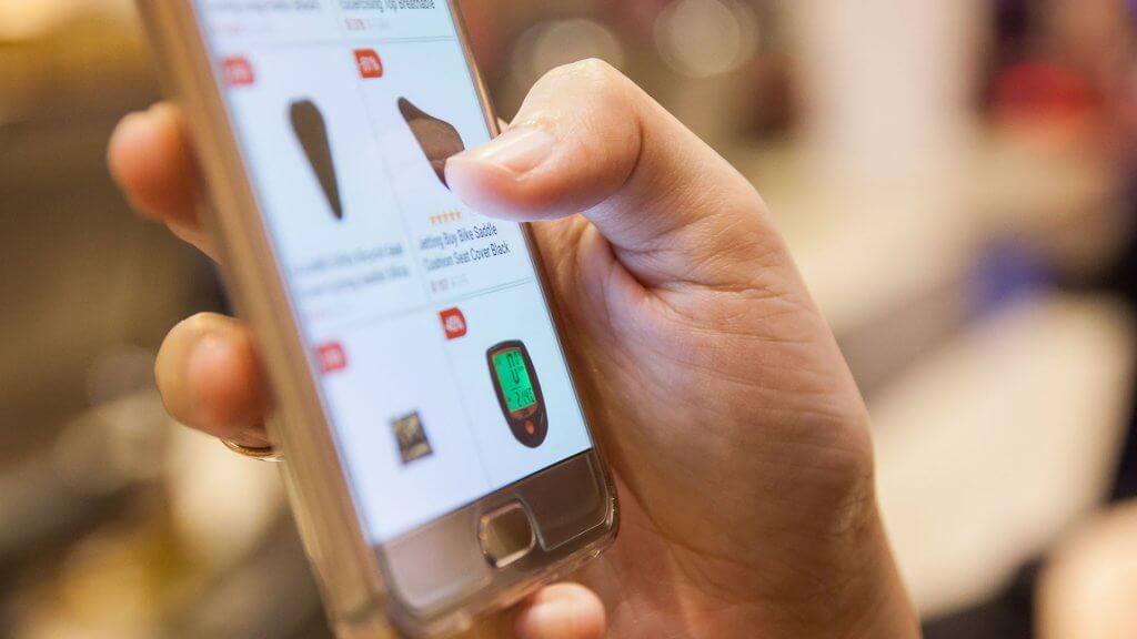 Use Price Matching person shopping online on phone