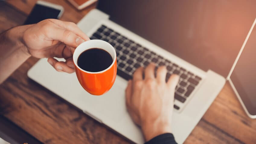coffee on laptop