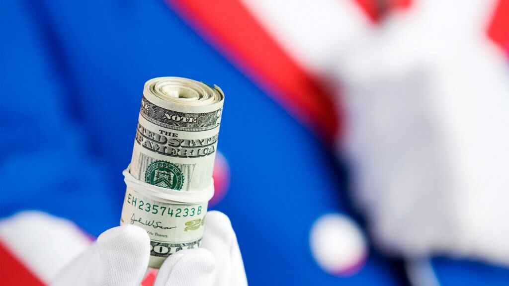 Prepare to Share That Big Raise With Uncle Sam person with white gloves holding a roll of cash