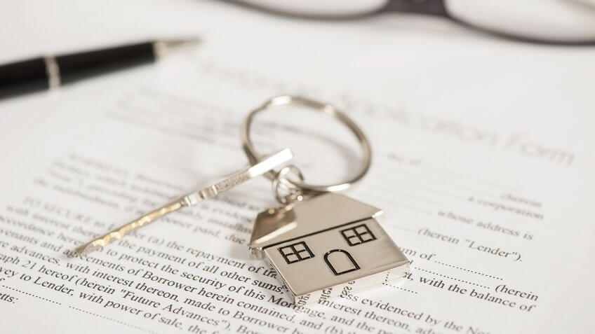silver key and house keychain