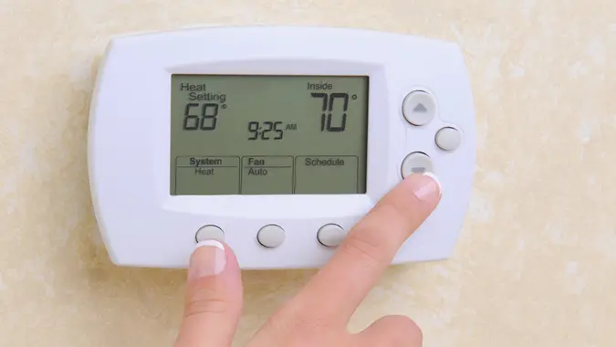 hand over thermostat