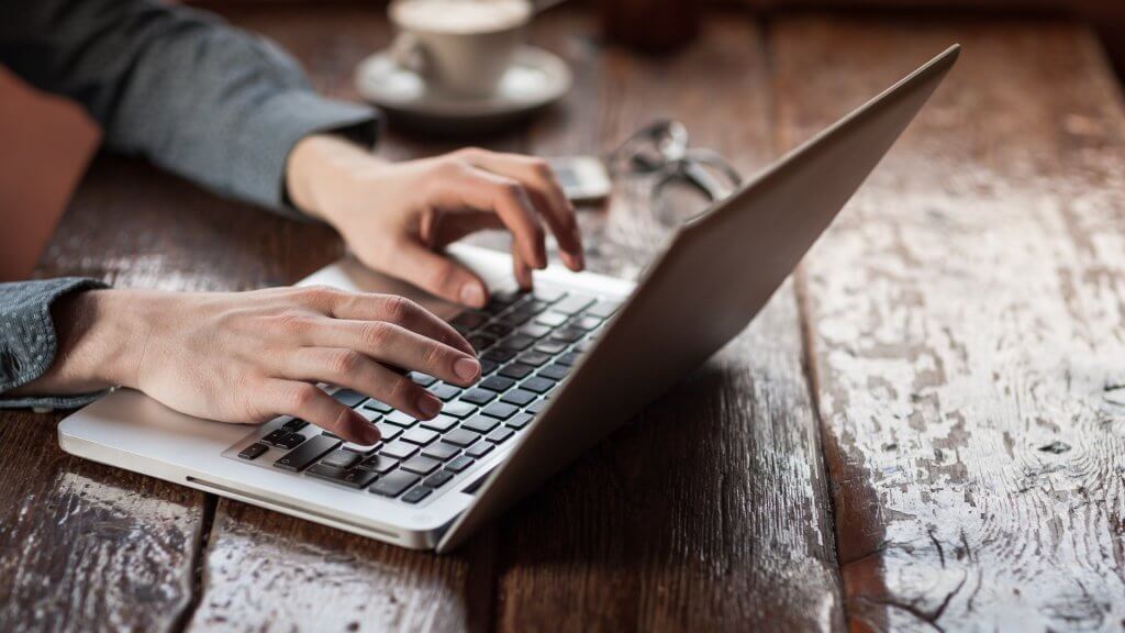Laptop Extended Warranties person typing on laptop