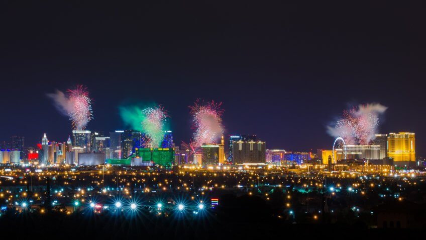 View of Las Vegas strip at night with firework display on New Year Day.