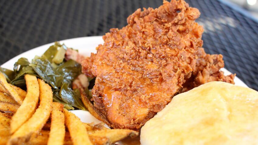 fried chicken, mashed potatoes, collard greens and french fries