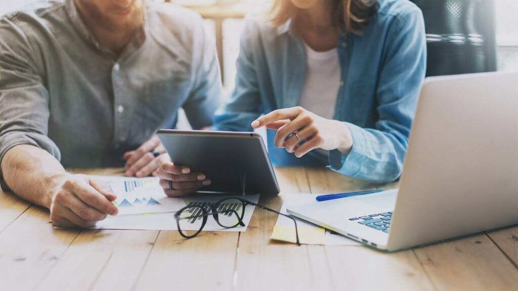 Invest in a Financial Planner people in a meeting using technology