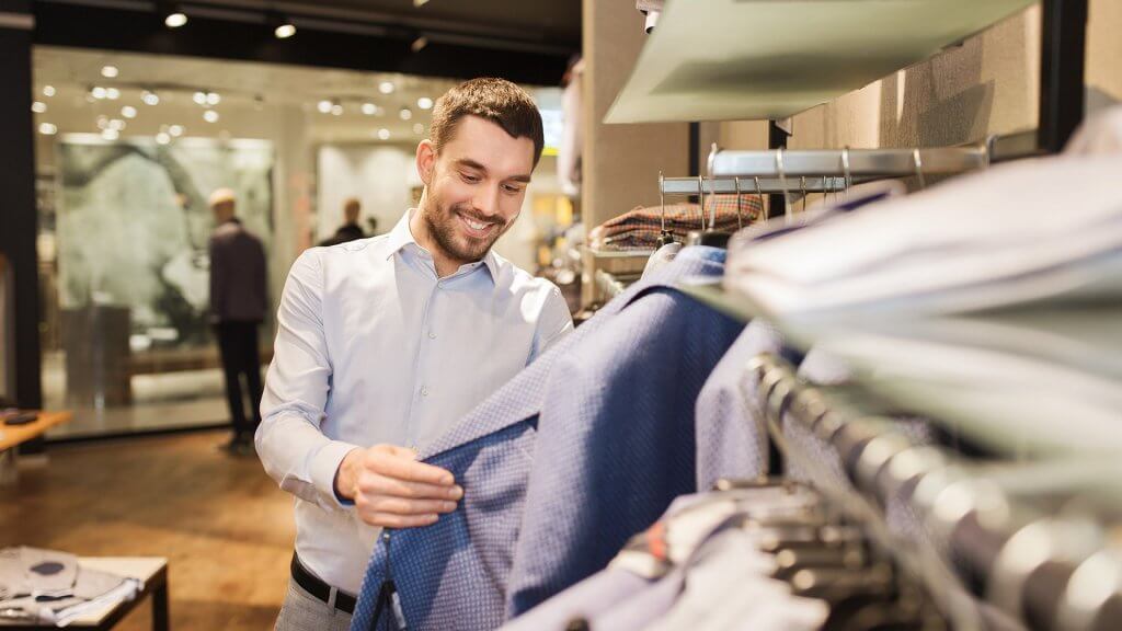 Splurge on a New Wardrobe man shopping for suits