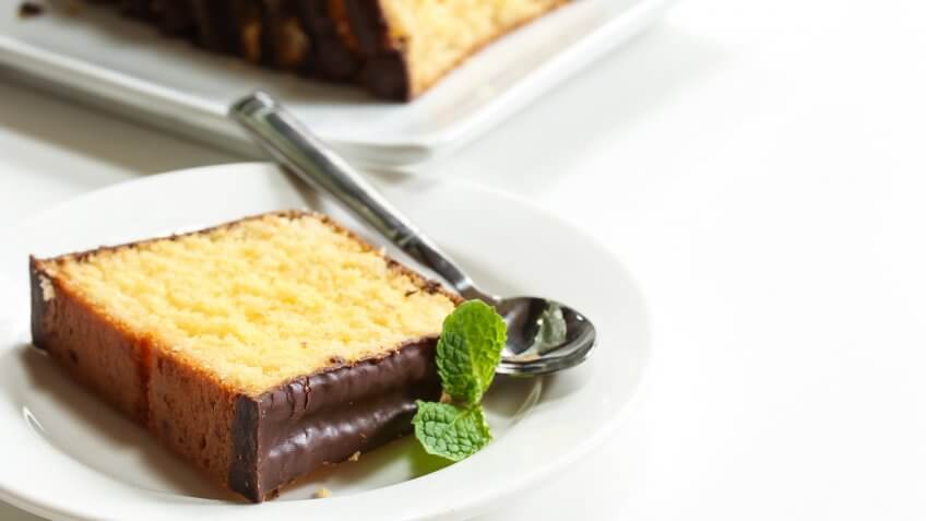 Slices of pound cake on a white dessert plate isolated on white.