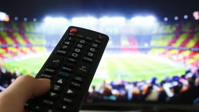 Football match and remote control.