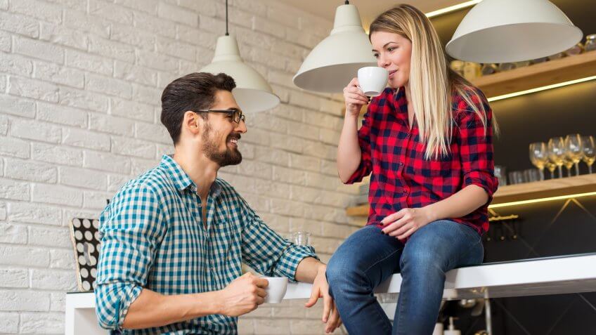 couple drinking coffee in house
