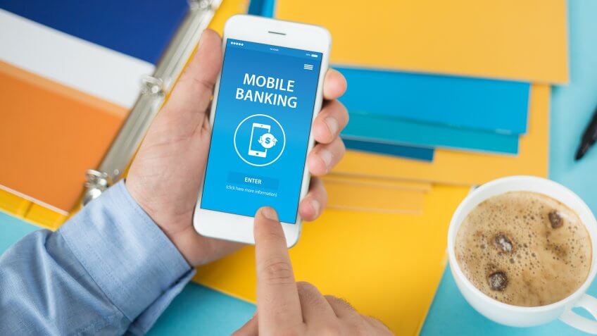 hands using mobile banking app