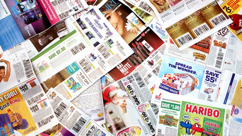 Colorado, USA - July 13, 2016: Studio shot of a pile of manufacturer coupons.