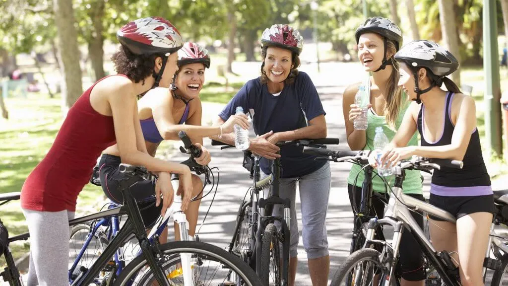 group of women on bicycles gathered together