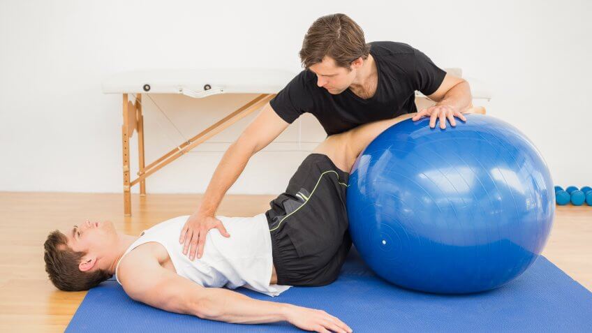 men practicing physical therapy