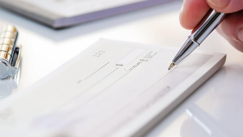 close up of writing a check