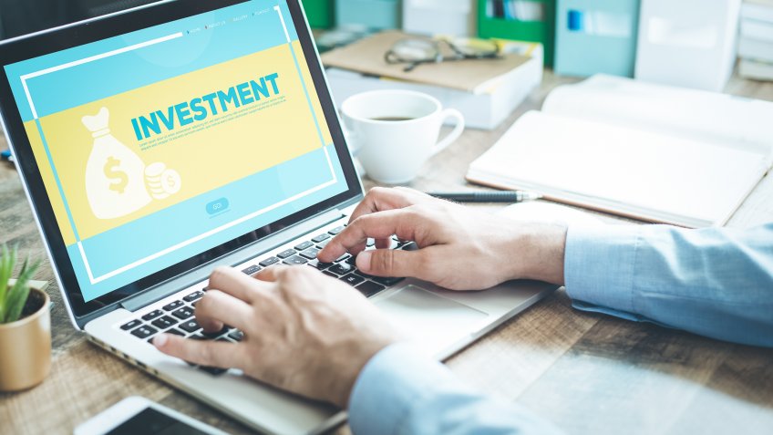 looking up investments on a laptop