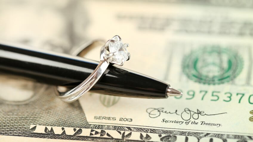 US dollar with pen and ring