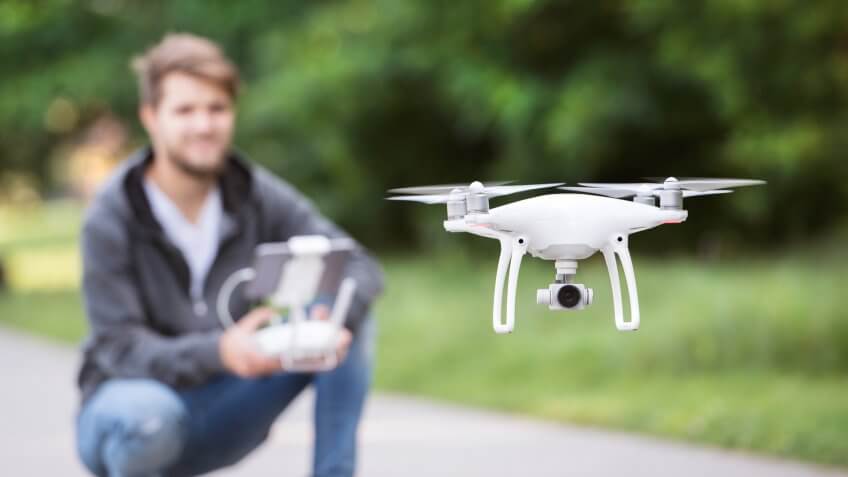 man playing with drone