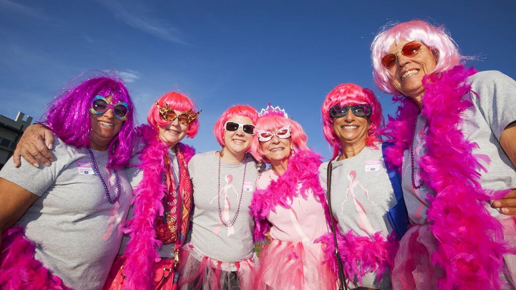 Race for a Cause group of women dressed in garish pink wigs and accessories
