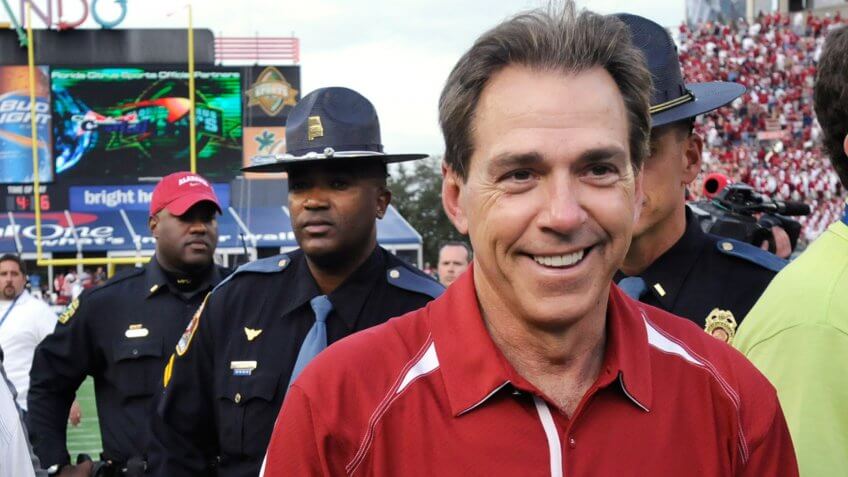Alabama's Nick Saban, right, smiles after their win over Michigan in the Capital One Bowl in Orlando, FL.
