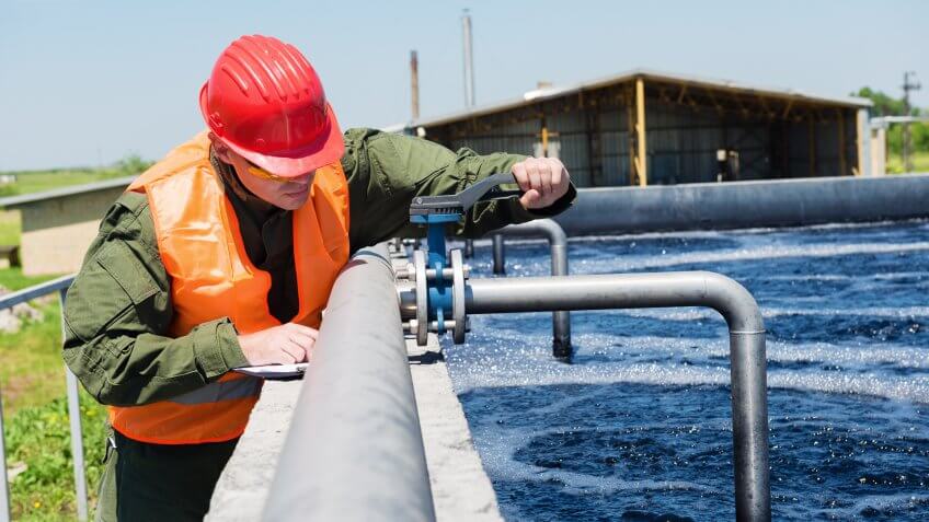 construction worker working on water pipes