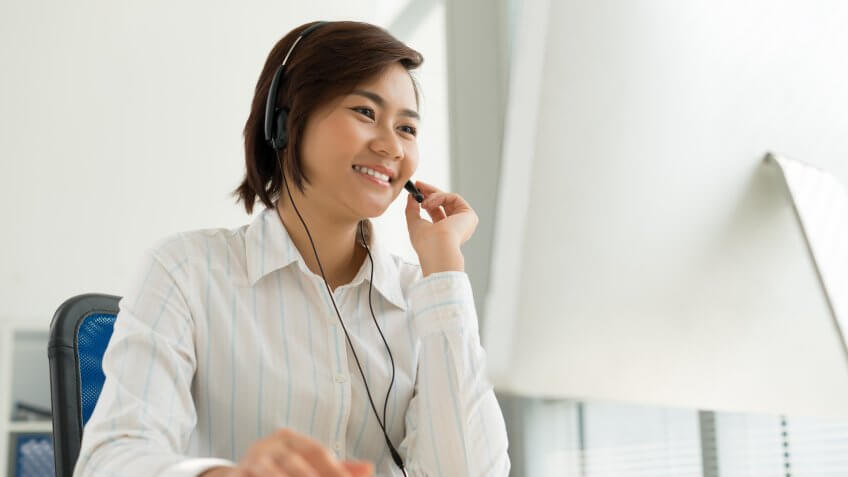 woman talking on the phone with a headset